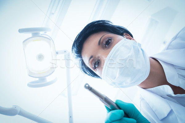 Női fogorvos műtősmaszk tart fogászati fúró Stock fotó © wavebreak_media