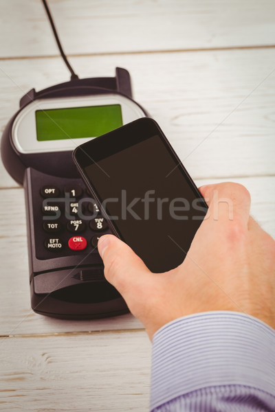 Man using smartphone to express pay  Stock photo © wavebreak_media