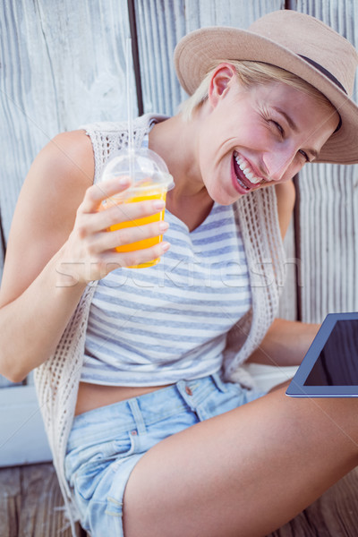 Güzel sarışın kadın tablet portakal suyu ahşap Stok fotoğraf © wavebreak_media