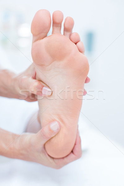 Stock photo: Physiotherapist doing foot massage