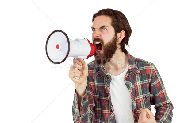 Handsome hipster shouting through megaphone Stock photo © wavebreak_media