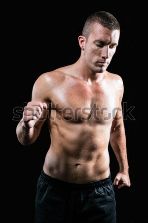 Stock photo: Handsome bodybuilder with arms crossed