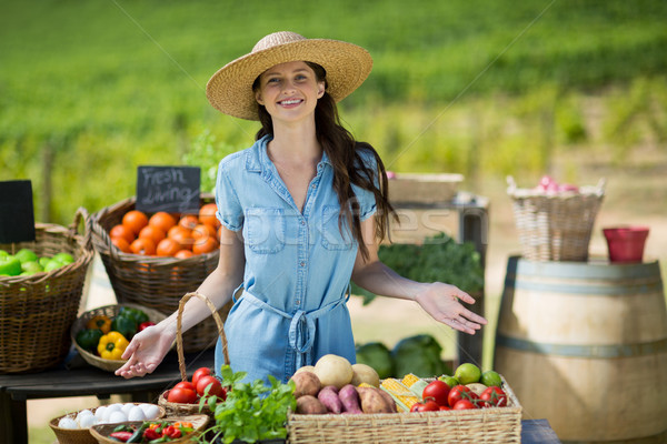 Portrait of smiling woman selling vegetables Stock photo © wavebreak_media