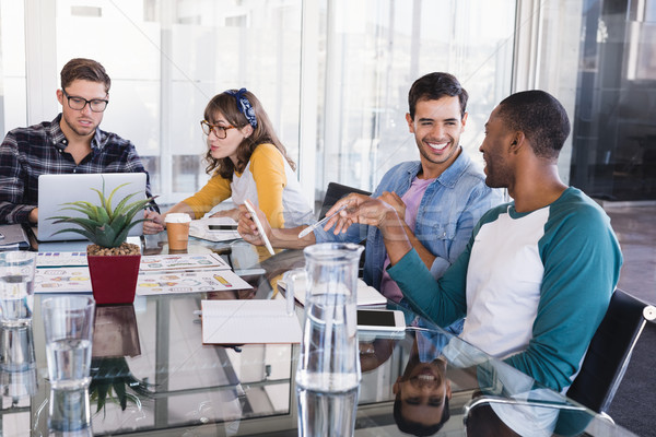 Creative business team working around glass table Stock photo © wavebreak_media