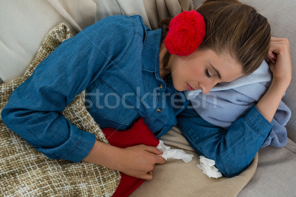 Directly above shot of woman sleeping on sofa at home Stock photo © wavebreak_media