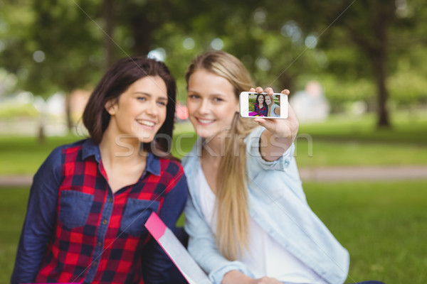 Smiling students taking a selfie outdoor  Stock photo © wavebreak_media