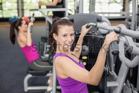 Smiling woman working out with dumbbells Stock photo © wavebreak_media