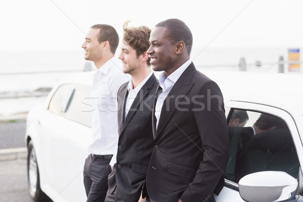 Jólöltözött férfiak pózol dől limuzin bulizás Stock fotó © wavebreak_media
