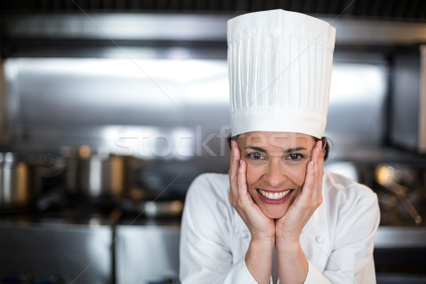 Portrait of beautiful female chef in kitchen Stock photo © wavebreak_media