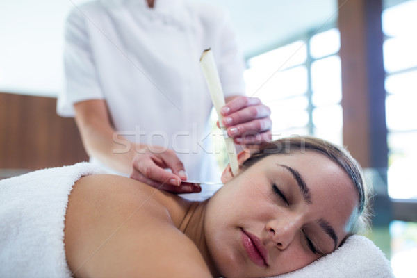 Woman receiving ear candle treatment Stock photo © wavebreak_media