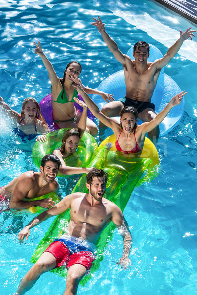 Group of friends having fun in swimming pool Stock photo © wavebreak_media