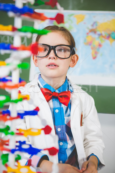 School girl assembling molecule model for science project in lab Stock photo © wavebreak_media