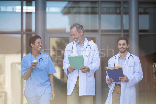 Stock photo: Nurse and surgeons interacting with each other