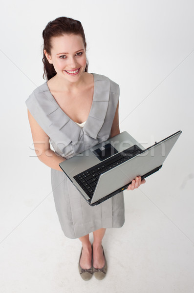 Imprenditrice utilizzando il computer portatile sorridere computer donna Foto d'archivio © wavebreak_media