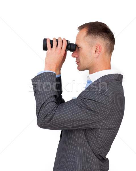 Serious businessman using binoculars Stock photo © wavebreak_media