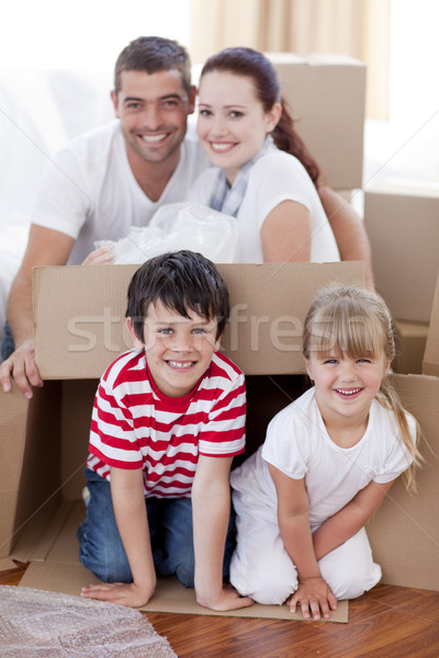 Family moving house playing with boxes Stock photo © wavebreak_media