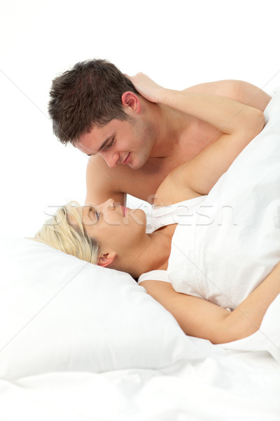 Amoroso casal relaxante cama menina Foto stock © wavebreak_media