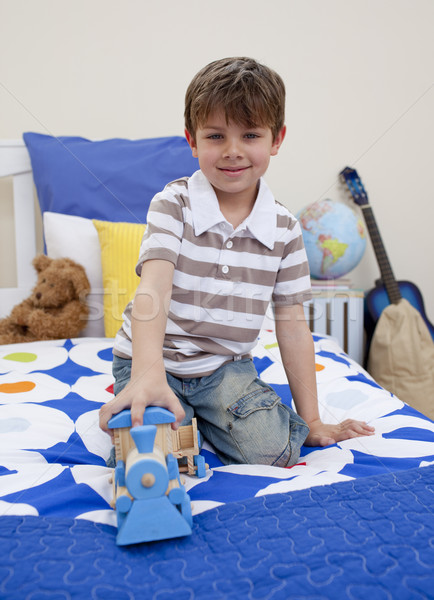 Little boy playing with a train in his bedroom Stock photo © wavebreak_media