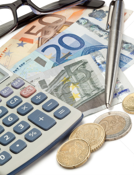 Cash, coins, pen, glasses and pocket calculator Stock photo © wavebreak_media