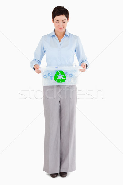 Businesswoman with a recycling box against a white background Stock photo © wavebreak_media