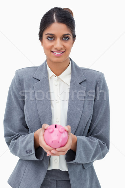 [[stock_photo]]: Souriant · banque · employé · tirelire · blanche