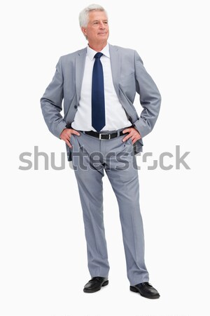 Man in a suit with his hands on his hips against white babckground Stock photo © wavebreak_media