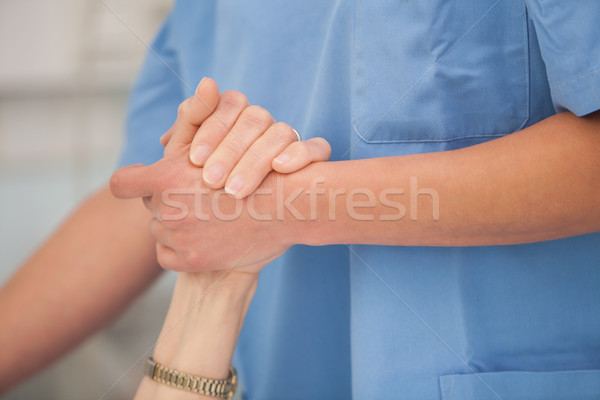 Nurse holding the hands and take care of the elderly woman Stock photo © wavebreak_media