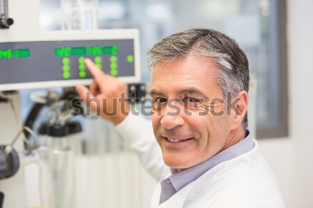 Stock photo: Technician changing cables in the server case