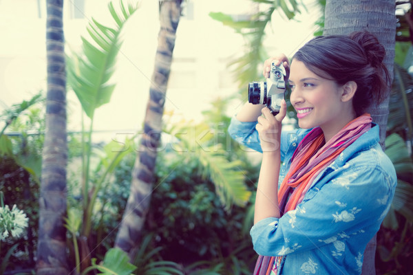 Happy brunette taking a photo outside  Stock photo © wavebreak_media