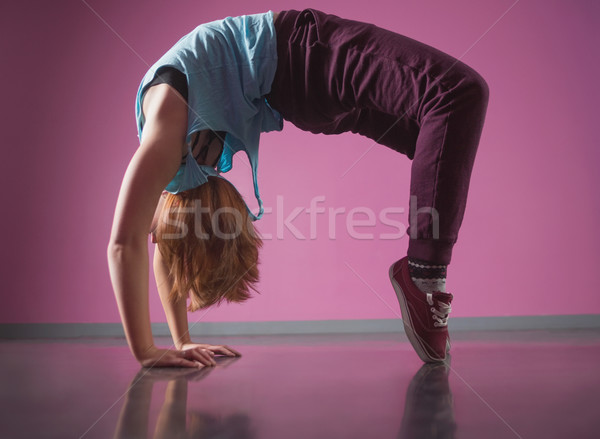 Stock photo: Pretty break dancer doing a back bend