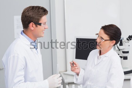Dentist and assistant studying x-rays Stock photo © wavebreak_media