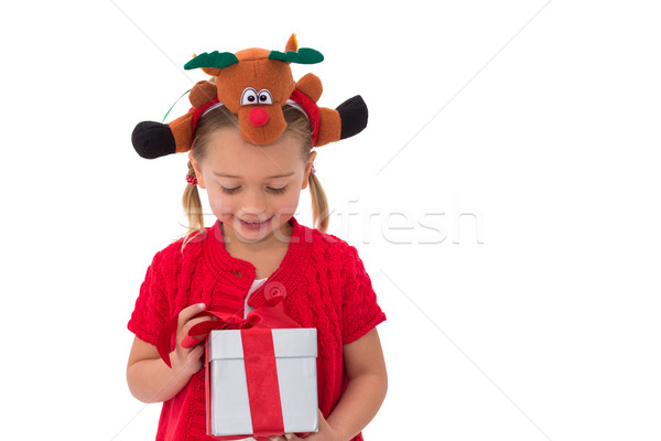 Cute little girl wearing rudolph headband Stock photo © wavebreak_media