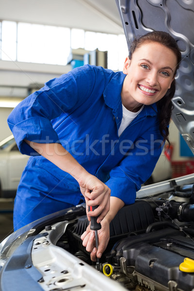 [[stock_photo]]: Souriant · mécanicien · travail · réparation · garage · heureux