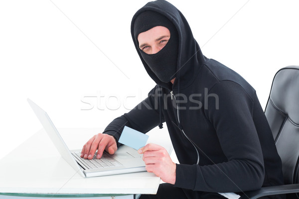 Hacker za pomocą laptopa karty kredytowej biały technologii notebooka Zdjęcia stock © wavebreak_media