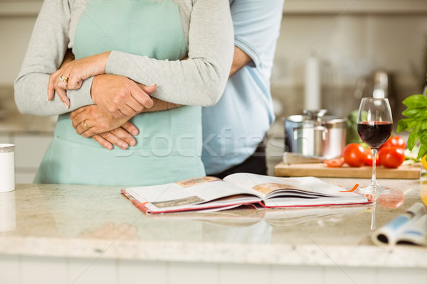 Stock photo: Mature couple preparing vegetarian meal together