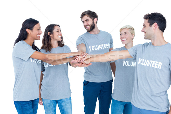 Vrijwilligers vrienden handen samen gelukkig man Stockfoto © wavebreak_media