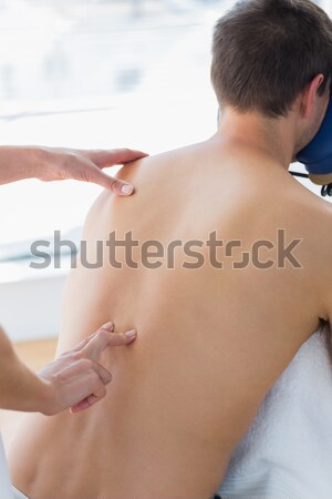 Brunette touching her painful neck Stock photo © wavebreak_media