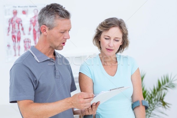 Woman using crutch and talking with her doctor Stock photo © wavebreak_media