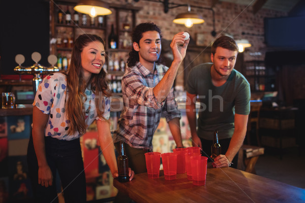 Group of happy friends playing game  Stock photo © wavebreak_media