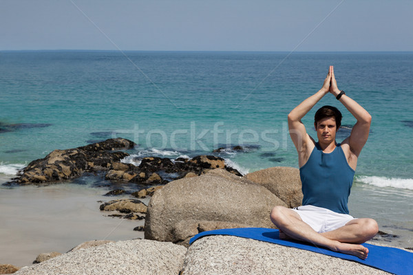 Tam uzunlukta adam meditasyon plaj oturma egzersiz Stok fotoğraf © wavebreak_media