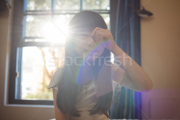 Girl waking up and rubbing her eyes in bedroom Stock photo © wavebreak_media