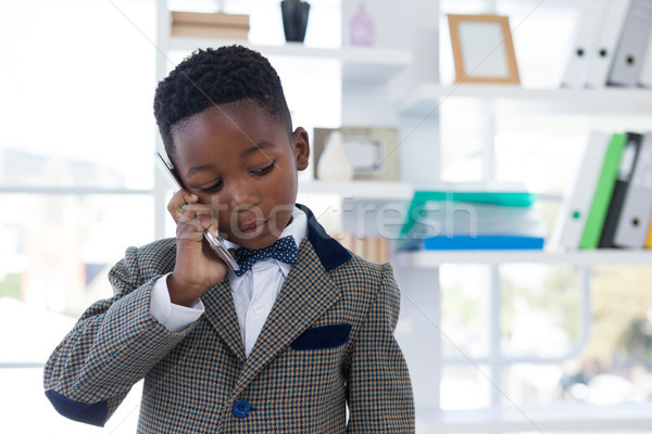 Serious businessman talking on mobile phone Stock photo © wavebreak_media