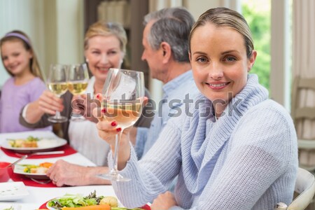 Group of friends celebrating womans birthday at outdoor restaurant Stock photo © wavebreak_media