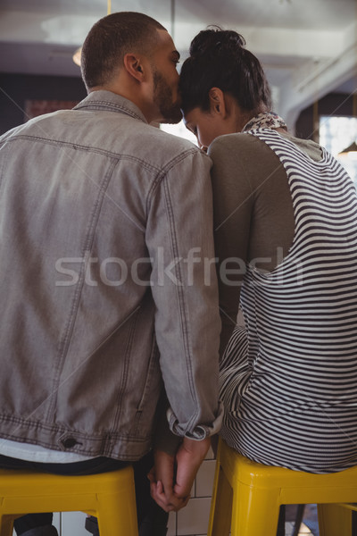 Man kissing on woman head in cafe Stock photo © wavebreak_media