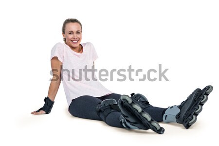 Portrait of happy female inline skater relaxing Stock photo © wavebreak_media