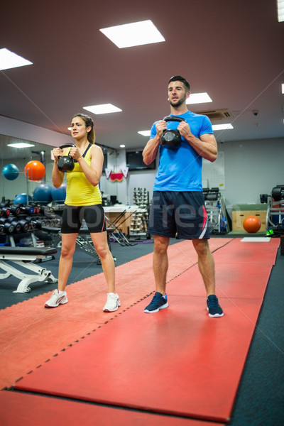 Man and woman working out using kettle bells Stock photo © wavebreak_media