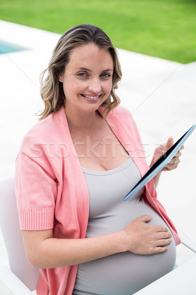 Donna incinta tablet donna home incinta piscina Foto d'archivio © wavebreak_media