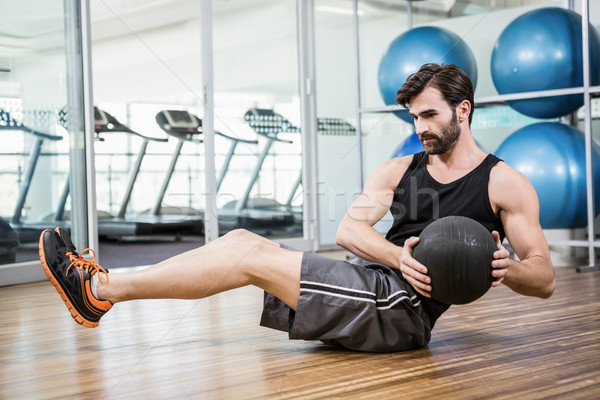 Homem exercer medicina bola estúdio fitness Foto stock © wavebreak_media