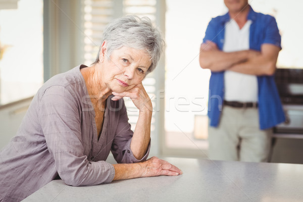 Portrait of worried senior woman with man standing in background Stock photo © wavebreak_media