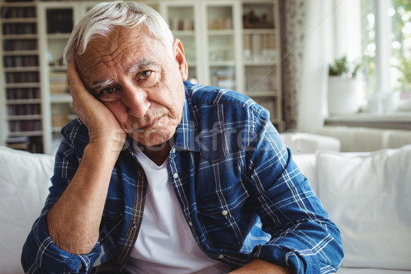Portrait of worried senior man sitting on a sofa Stock photo © wavebreak_media